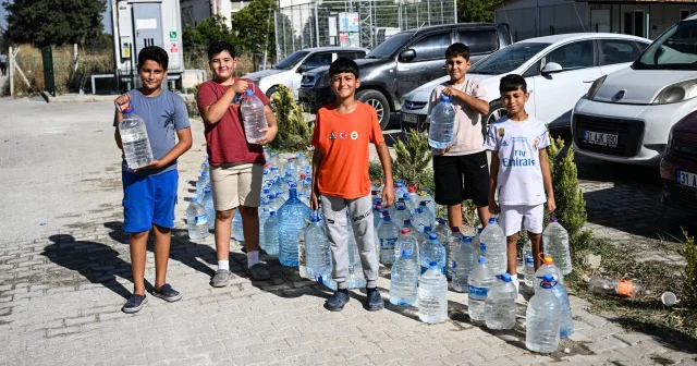 Hatay da yangınla mücadeleye çocuklardan destek VİDEO İZLE