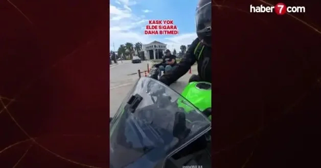 Kırmızı ışıkta geçen motosikletliye tokatlı tepki