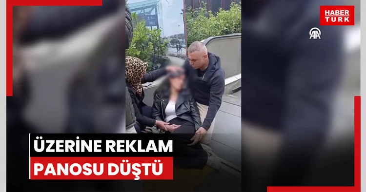 Üzerine reklam panosu düştü
