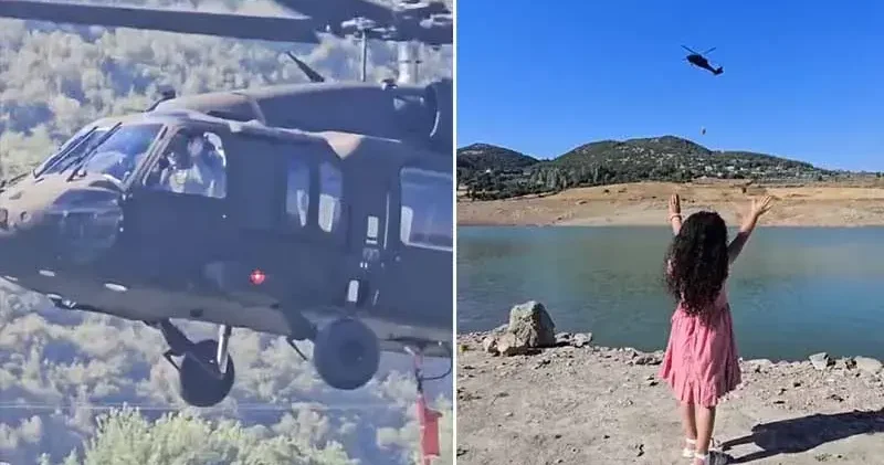 Yangına müdahale eden askeri helikopterin pilotu, kendisini selamlayan çocuğa el salladı