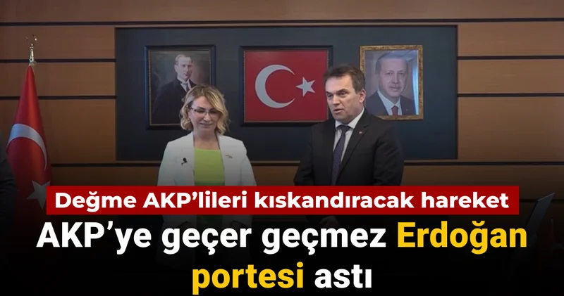 CHP den AKP ye geçen belediye başkanı ilk iş Erdoğan portesi astı