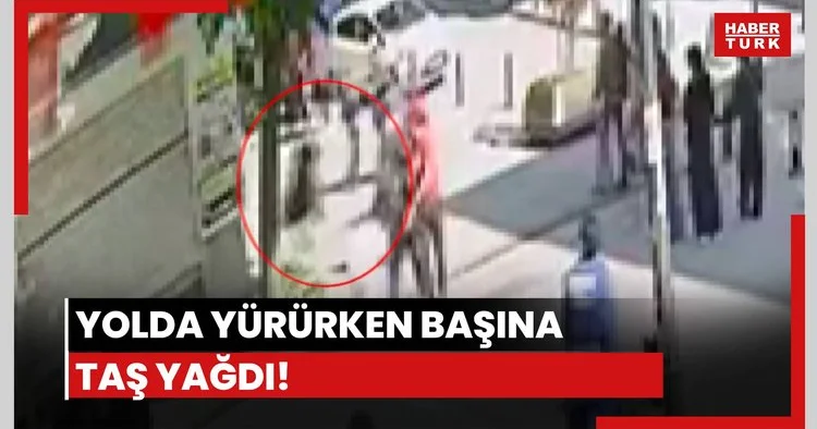 Yolda yürürken kafasına taş yağdı!