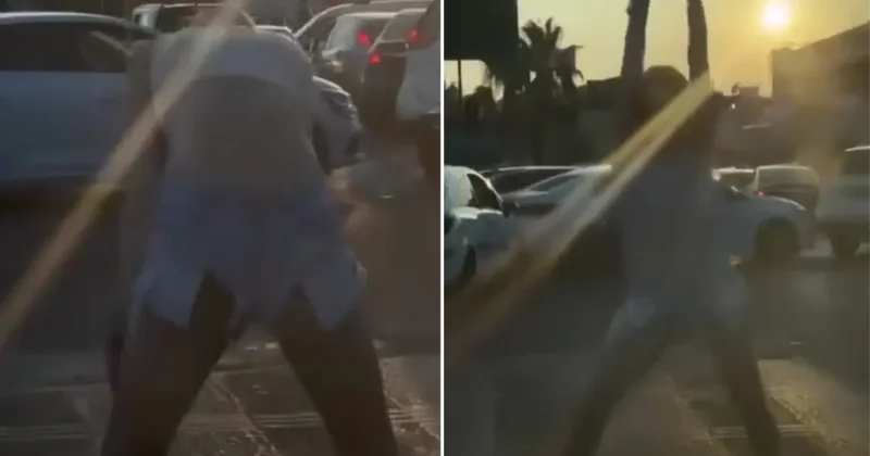 Genç kadın, araçlara aldırış etmeden yol ortasında dans etti